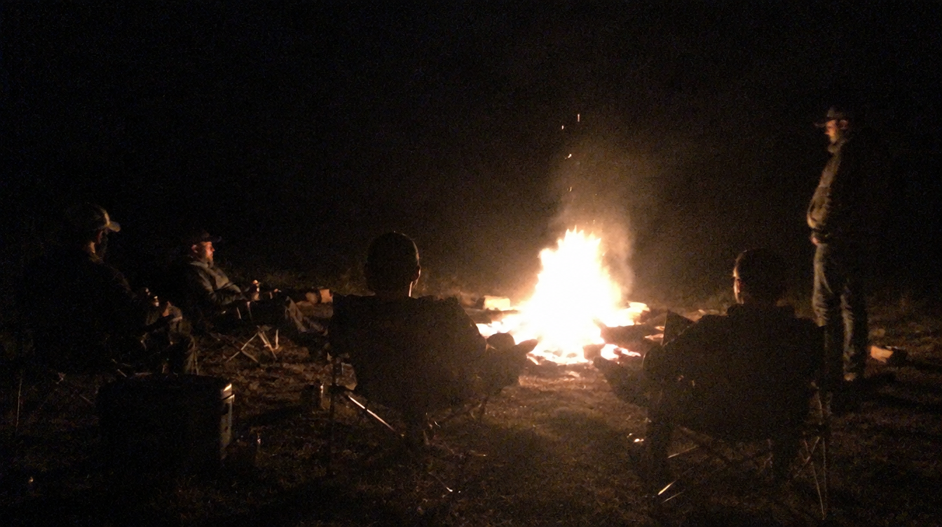 The tribe around a real fire at night